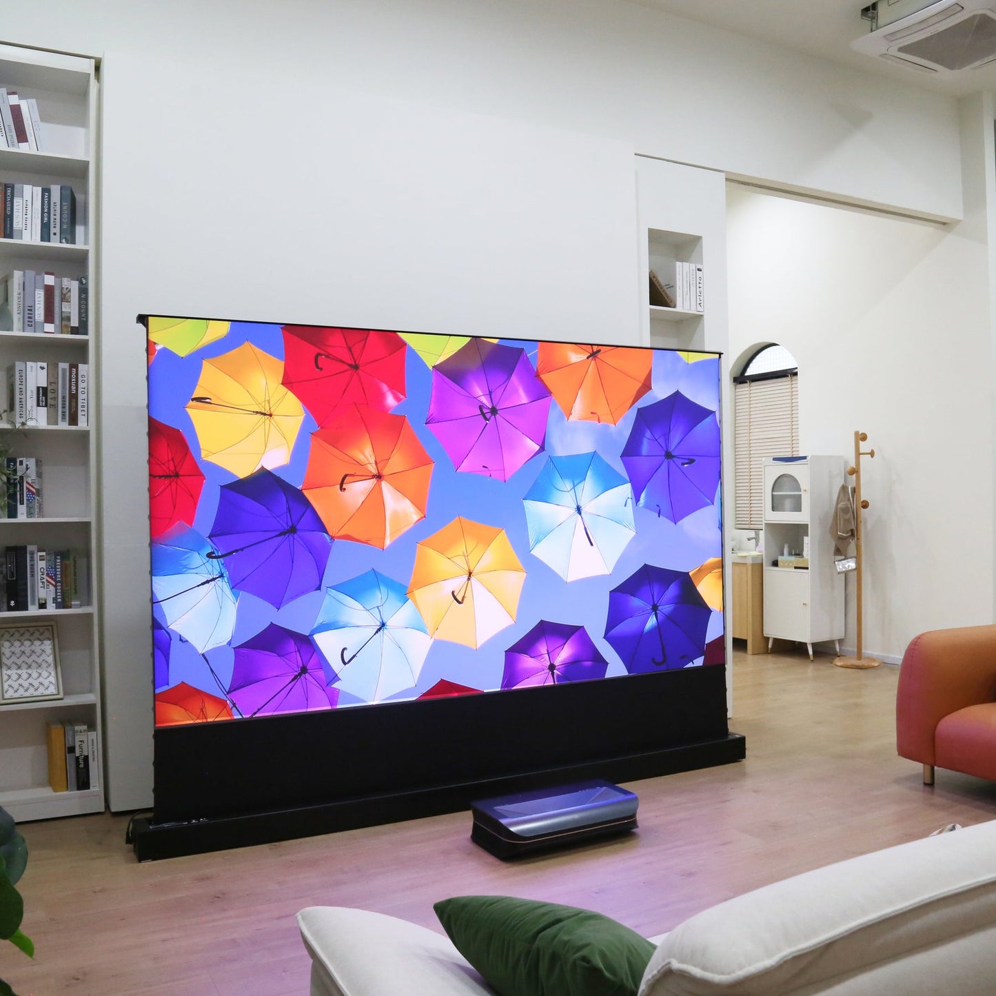 AWOL Vision matte white motorized floor rising projector screen for flexible home theater setup